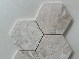 Polished marble hexagon mosaic tile featuring a timeless geometric pattern