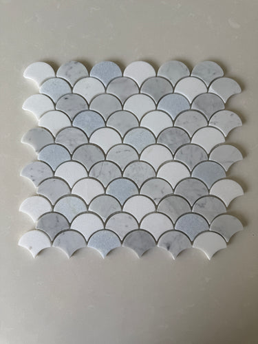 Roca Rockart blue mix Carrara Thassos fan-shaped 12x12 inch natural stone mosaic tile with blue, white, and gray tones.
