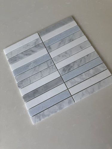 Rockart polished blue and white stacked natural stone mosaic used on an interior floor
