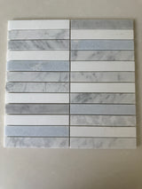Blue Mix Carrara Thassos stacked mosaic installed on a sophisticated shower wall
