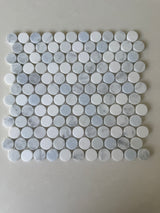 Blue and mixed natural stone penny round mosaic tile by Roca, 12x12 inches, ideal for showers and decorative surfaces.