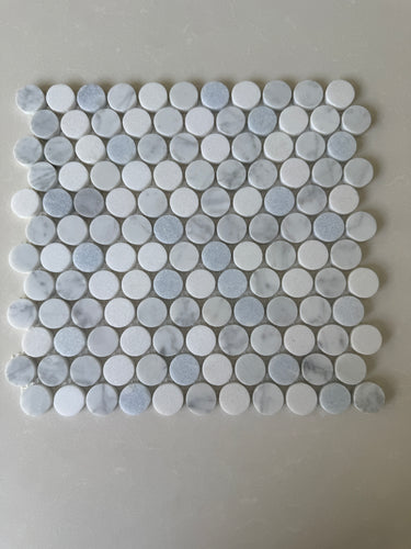 Blue and mixed natural stone penny round mosaic tile by Roca, 12x12 inches, ideal for showers and decorative surfaces.