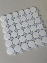 Natural stone tile mosaic featuring blue mix Thassos circles from Roca, 12x12 inch blue mosaic for flooring or wall decor.