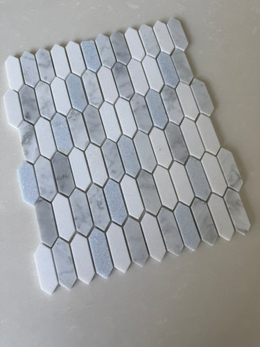 Natural stone tile from Roca, blue mix Thassos picket mosaic, 10x12 inch backsplash with textured stone pattern.