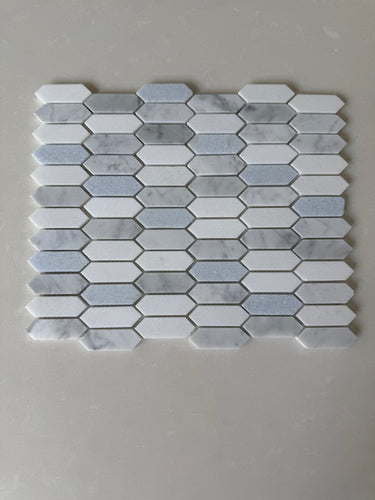 Natural stone tile from Roca's Rockart Blue Mix Thassos Picket mosaic, featuring blue and white Thassos stone for shower walls.