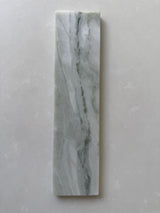 Polished green marble brick tile by Roca, natural stone 2x10 wall tile with elegant veining and glossy finish.