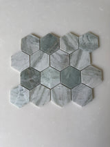Green marble hexagon mosaic tile by Roca, natural stone surface with a polished finish, ideal for flooring or decorative applications.