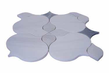 Close-up of Selene White Flower Waterjet Honed Marble Mosaic Tile by Mythology Tile, showcasing intricate floral pattern and smooth honed finish.
