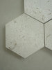 Shellstone Myra hexagon mosaic tile installed on a bathroom floor