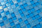 Crystal Aqua Osaka Sky Blue 1x1 glass mosaic tile used as a kitchen backsplash featuring a classic mosaic pattern and vibrant blue tones.