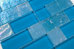 Crystal Aqua Osaka Sky Blue glass mosaic tile used as a kitchen backsplash featuring a decorative multiangular geometric pattern.