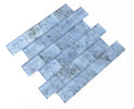 Pool-rated Crystal Aqua Sofia 2x3 glass mosaic tile installed on a luxury swimming pool waterline with reflective glass surfaces.