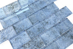 Crystal Aqua Sofia 2x3 glass mosaic tile used as a kitchen backsplash featuring a contemporary large-format mosaic design.