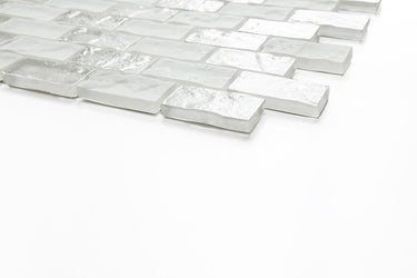 Pool-rated Soho White 1x2 glass mosaic tile installed on a luxury swimming pool waterline with crisp white tones.