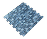 Pool-rated Stromboli Garden Blue glass mosaic tile installed on a luxury swimming pool waterline with refreshing blue color variation.