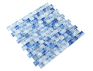 Pool-rated Stromboli Petra Blue glass mosaic tile installed on a luxury swimming pool waterline with rich blue color variation.