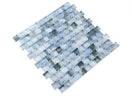 Pool-rated Stromboli Sky Blue glass mosaic tile installed on a luxury swimming pool waterline with bright blue reflective tones.