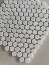 White Dolomite polished penny round mosaic tile with a timeless circular design