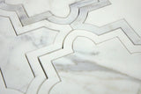 Close-up of honed white marble waterjet mosaic showing geometric detailing