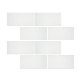 Six 12-inch honed Thassos white marble mosaic tiles with smooth, polished surface and natural veining, arranged in a grid pattern.