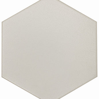 Gray hexagon floor tile from Roca's FLOW TENDER collection, measuring 8x9 inches, displayed in a modern interior setting.