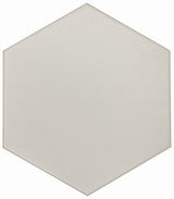 Gray hexagon floor tile from Roca's FLOW TENDER collection, measuring 8x9 inches, displayed in a modern interior setting.