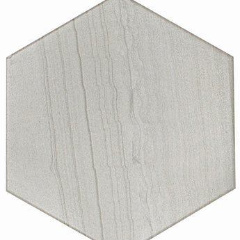 White hexagon floor tile from Roca's Legend Blanco 8x9 collection, showing a glossy surface and intricate geometric pattern.