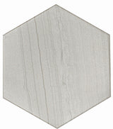 White hexagon floor tile from Roca's Legend Blanco 8x9 collection, showing a glossy surface and intricate geometric pattern.