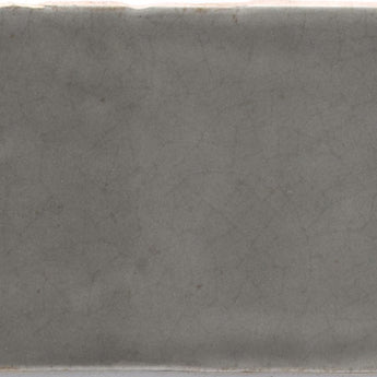 Taupe crackled Maiolica wall tile from Roca, 3x12 inches, with textured, rustic surface perfect for decorative wall applications.